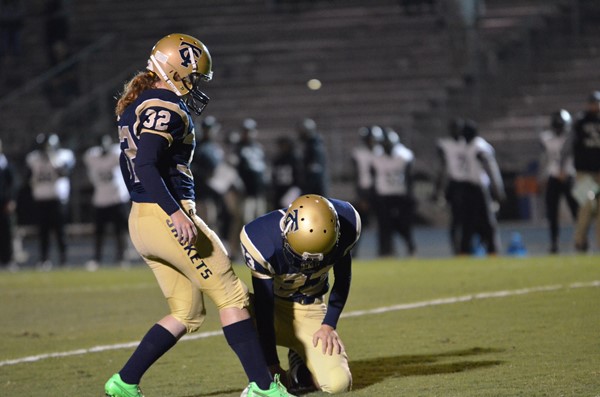 Lauren Pearson and Ryan Hollingsworth prepare to attempt a field goal.